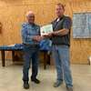 Josh Bondy presents Bob Mitchell certificate for 40 yrs as a 4-H volunteer