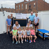 Ralls County Presiding Commissioner John Lake, Lick Creek Adventures Daycare and Preschool Director Kayla Stevener with Staff Members Tricia Asquith and Kelli Henry, Mark Twain Regional Council of Governments Planner Ashley Long, and Lick Creek Adventures Students.